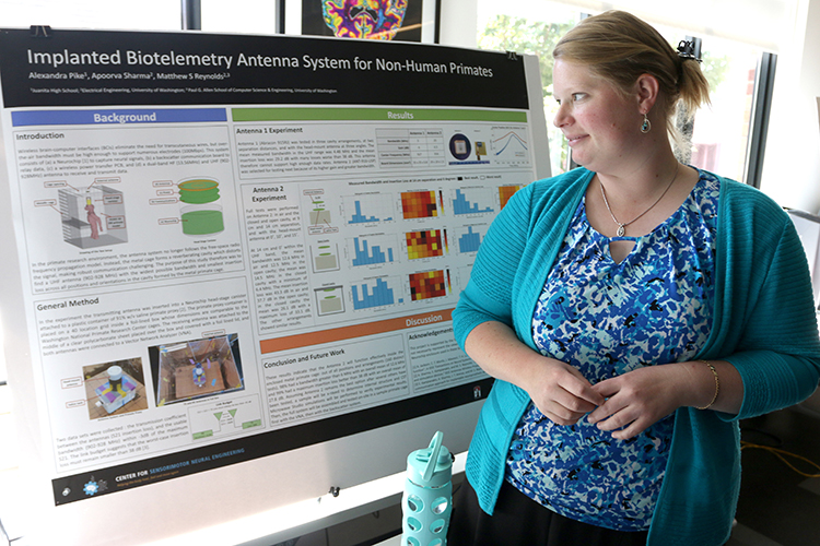 Alexandra Pike, with her research project poster at the CSNE